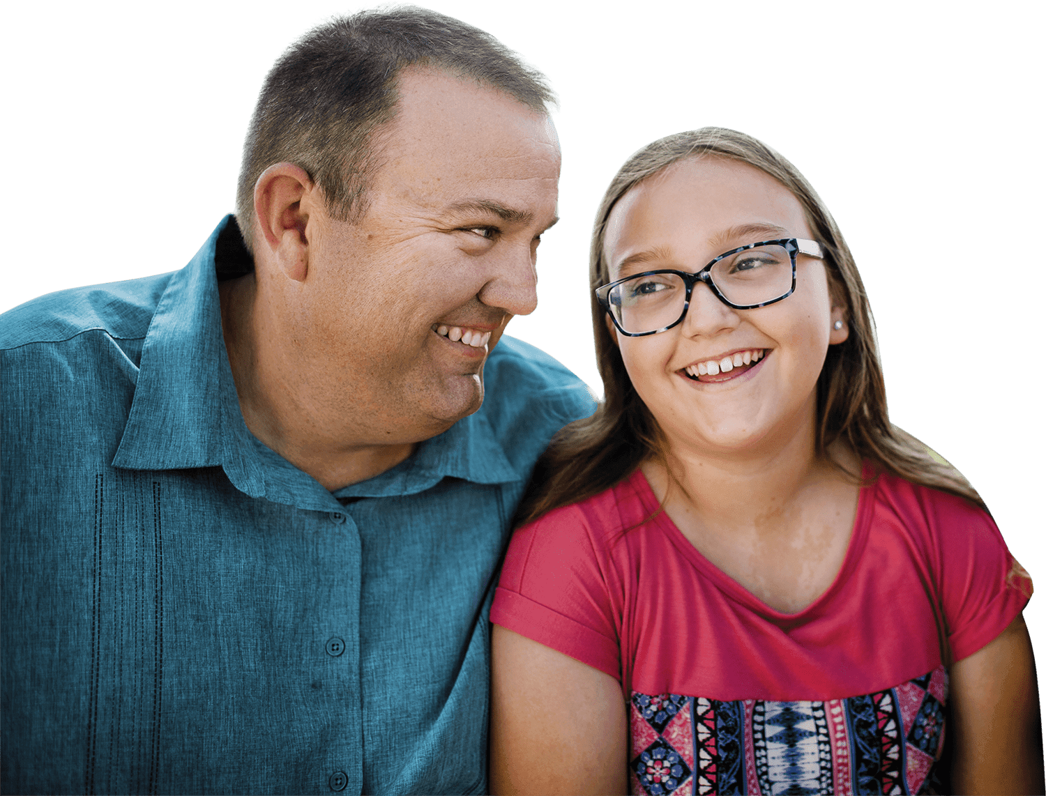 Father and daughter smiling and looking at each other. Actor portrayals.