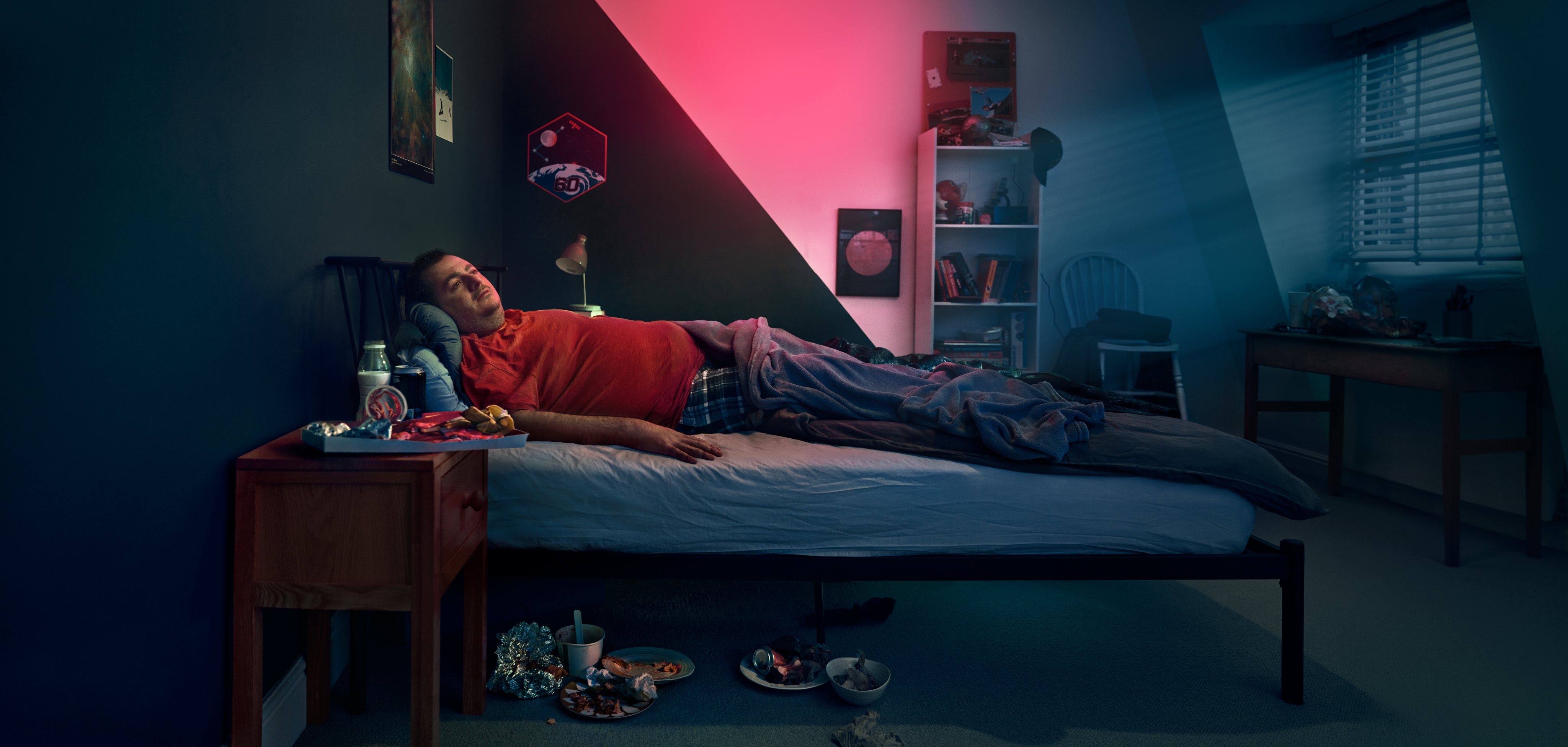 Man lying in a bed. Actor portrayal.
