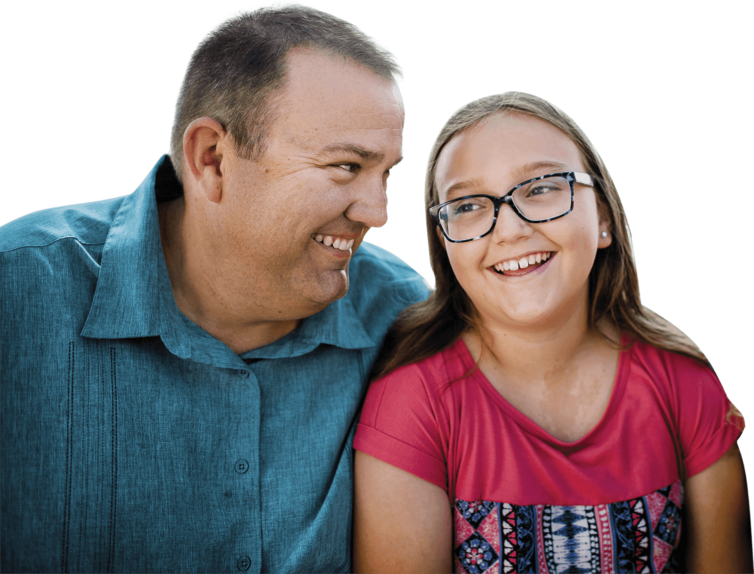 Father and daughter smiling and looking at each other. Actor portrayals.